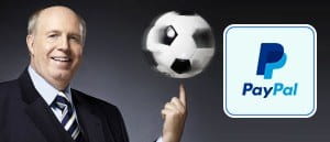 Reiner Calmund dreht einen Ball auf dem Finger und das Logo von PayPal.