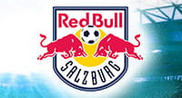 Alt: Das Logo von RB Salzburg und im Hintergrund ein Stadion.